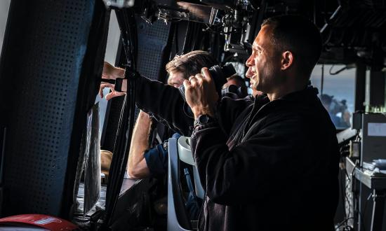 The executive officer of the amphibious transport dock USS Green Bay (LPD-20) scans the horizon during a Taiwan Strait transit. While the Navy has focused on human performance under increased stress, cognitive task analysis could be another tool to model small-team operations and maintenance procedures, identifying probable failure points and mitigations.